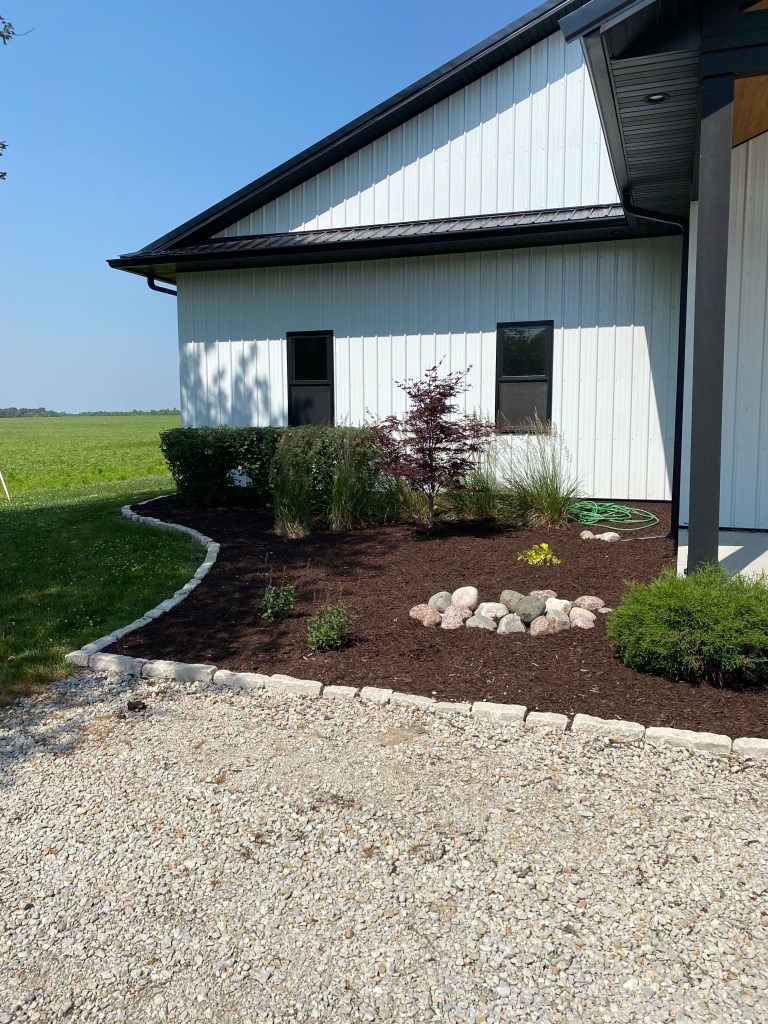 Landscaped garden bed beside a maintained commercial property