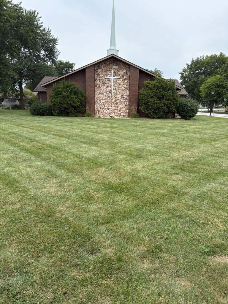 Freshly mowed lawn surrounding a church property